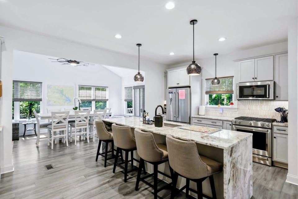 Kitchen - Bar stools line the oversized island, the natural gathering spot while meals come together.