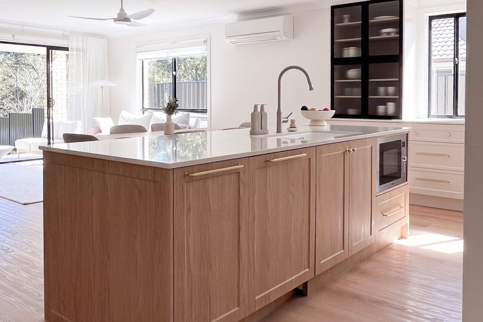 Kitchen : The kitchen island adds broad bench space, storage, an integrated sink and easy flow into the open-plan living area.