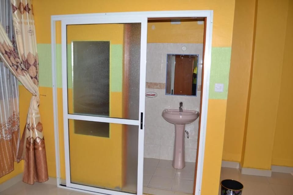 Deluxe Triple Room, City View | Bathroom | Shower, slippers, towels, soap