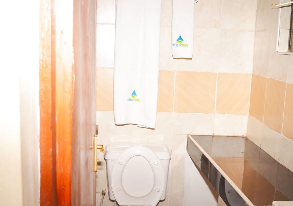 Deluxe Single Room, Garden View | Bathroom | Shower, slippers, towels, soap
