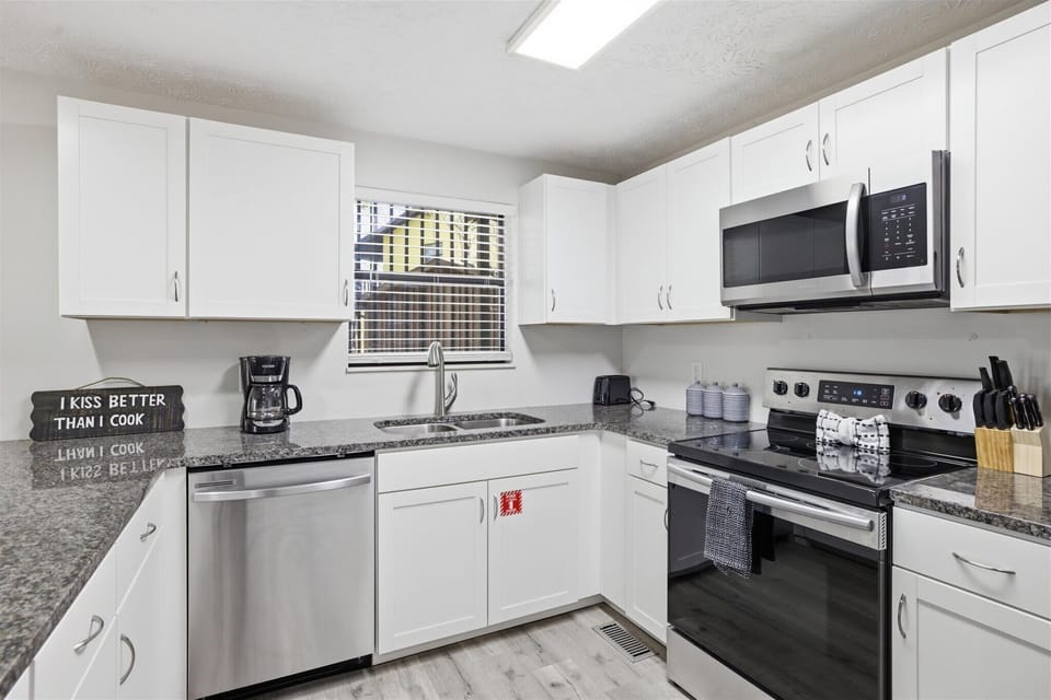 The kitchen features modern appliances and spacious counters for effortless cooking.