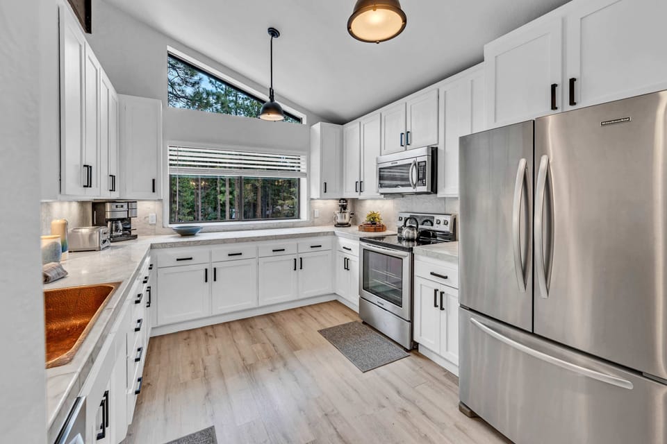 Kitchen: Open space with white countertops and new appliances