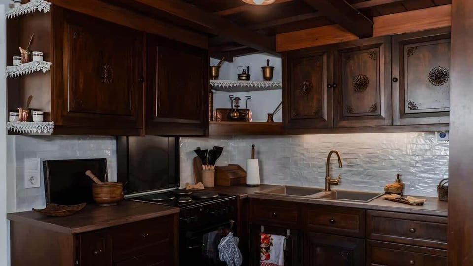 Warm wooden beams and a fully equipped kitchen blending old and new.