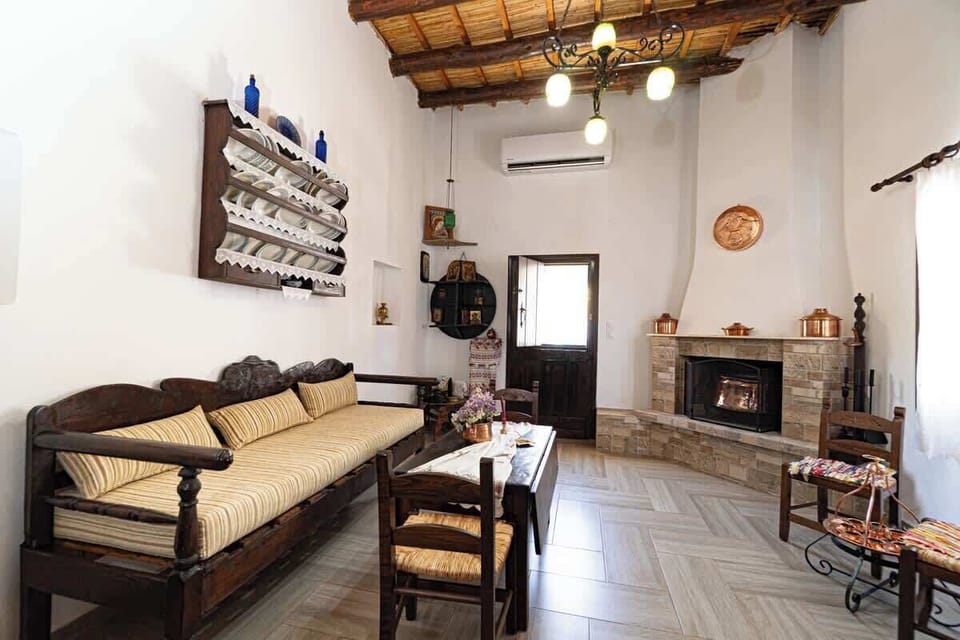 Rustic living room with stone walls and authentic Cretan character.