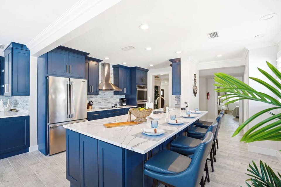The kitchen is equipped with a large island and plenty of seating. 