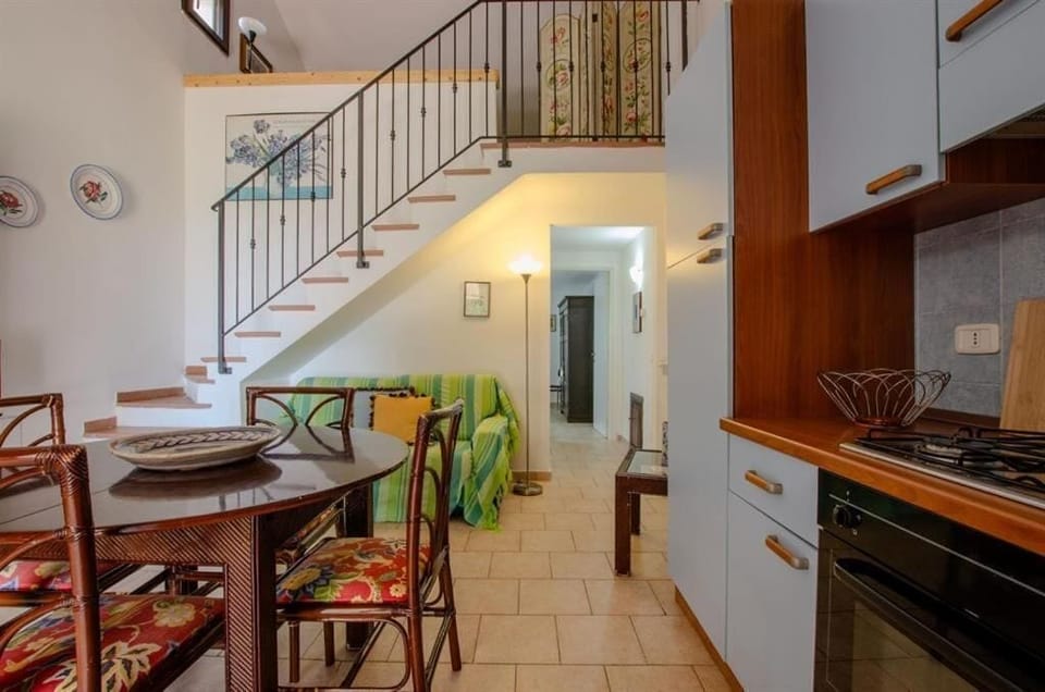 Family Loft, 2 Bedrooms, Patio, Garden View | Private kitchenette | Fridge, stovetop, cookware/dishes/utensils, dining tables