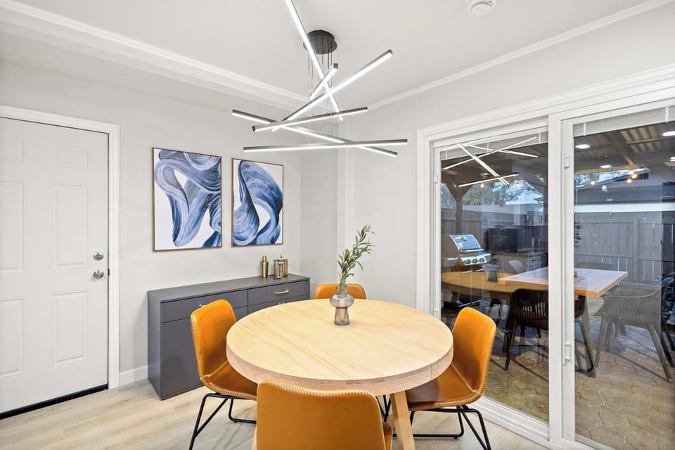 This cozy breakfast nook is the perfect spot to enjoy your morning sips of coffee, with a front-row view of the backyard and plenty of natural sunlight.