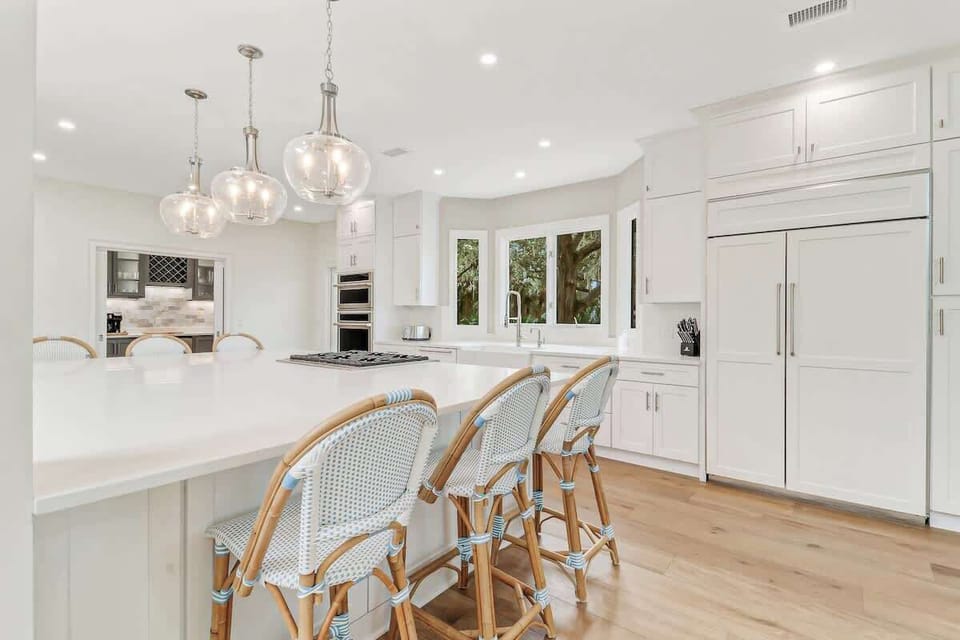 Your dream kitchen awaits with elegant pendant lighting, spacious marble counters, and premium appliances perfect for creating memorable meals.