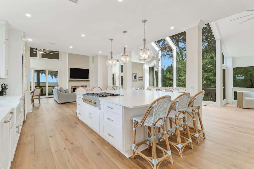 Your gourmet kitchen flows seamlessly into the living space, featuring a stunning island perfect for cooking and gathering with friends.