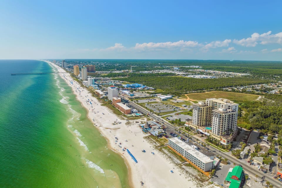 Stunning coastal location with pristine white sand beaches and turquoise waters stretching along the shoreline.