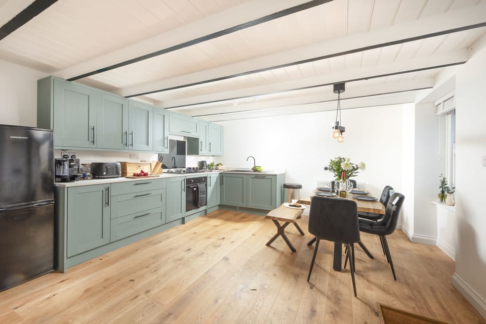 Kitchen and dining area full of character - Harbour Watch Cottage