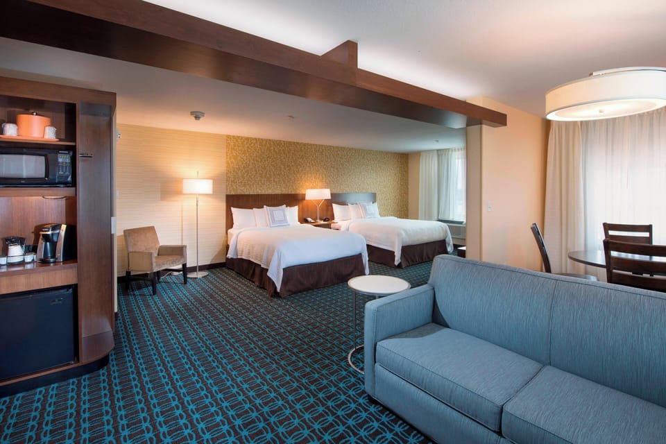 Suite, Multiple Beds | Pillowtop beds, desk, iron/ironing board, free WiFi