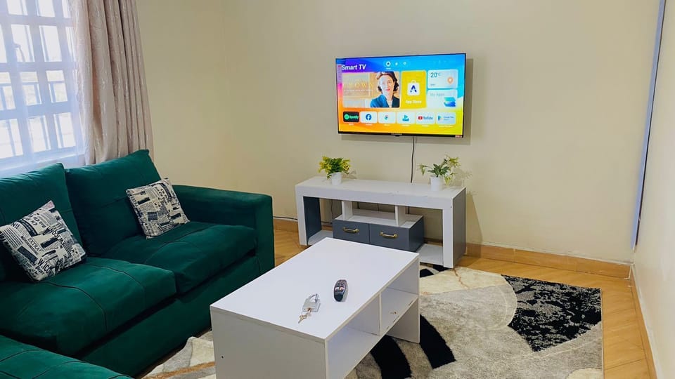 Family Apartment | Living area | 32-inch Smart TV with digital channels