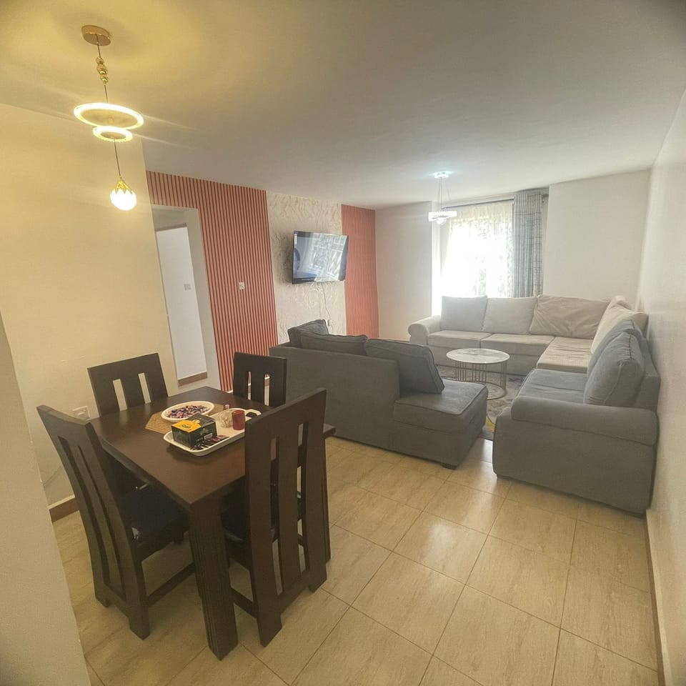 Family Apartment | Living area | 32-inch Smart TV with digital channels