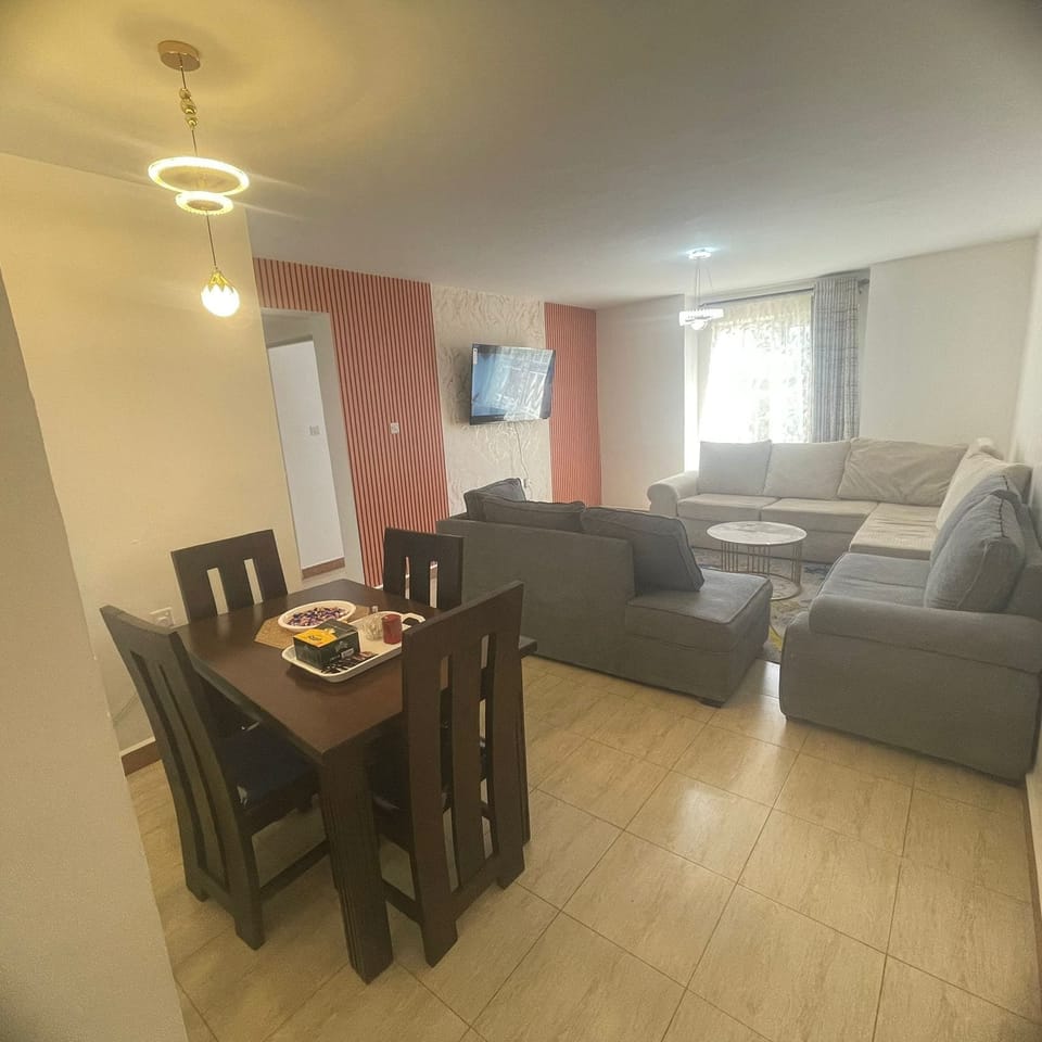 Family Apartment | Living area | 32-inch Smart TV with digital channels
