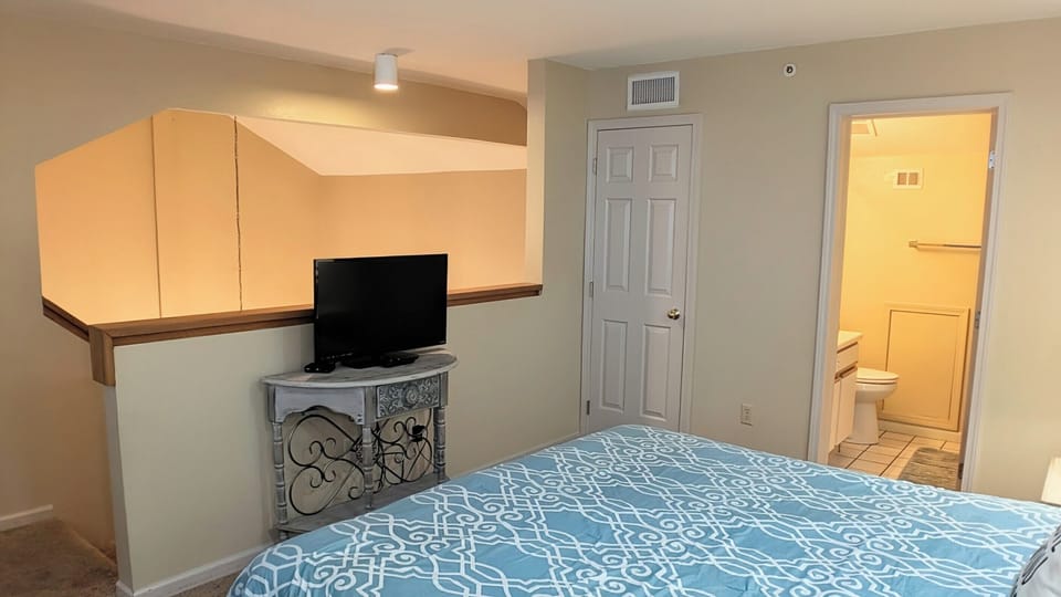 Loft bedroom with ensuite bathroom