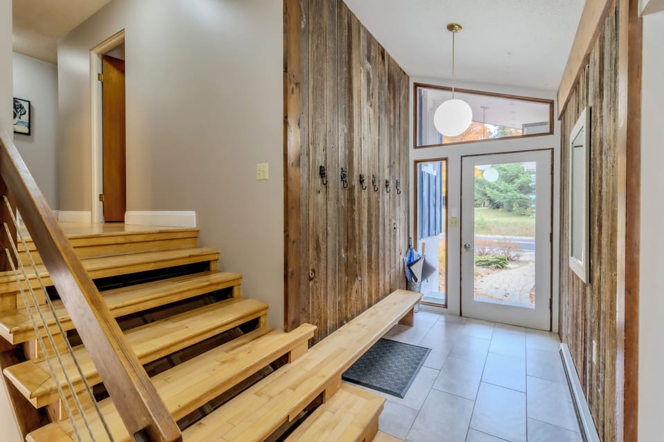 Entry - Entryway with bench and hooks. Stairs up lead to bedrooms and bathrooms.