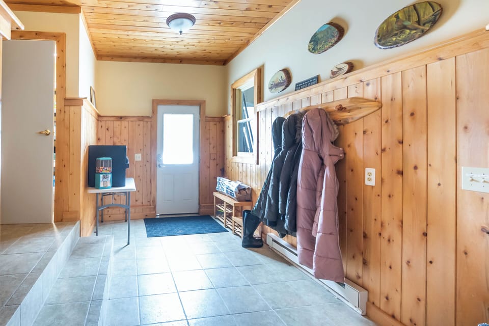 Mud Room - The entry guests mainly use opens into the mudroom. The garage is off to the right in this photo and the entry to the house is on the left. The entry is a hallway, which has one bedroom on one side and one bathroom on the other and leads to the living room.