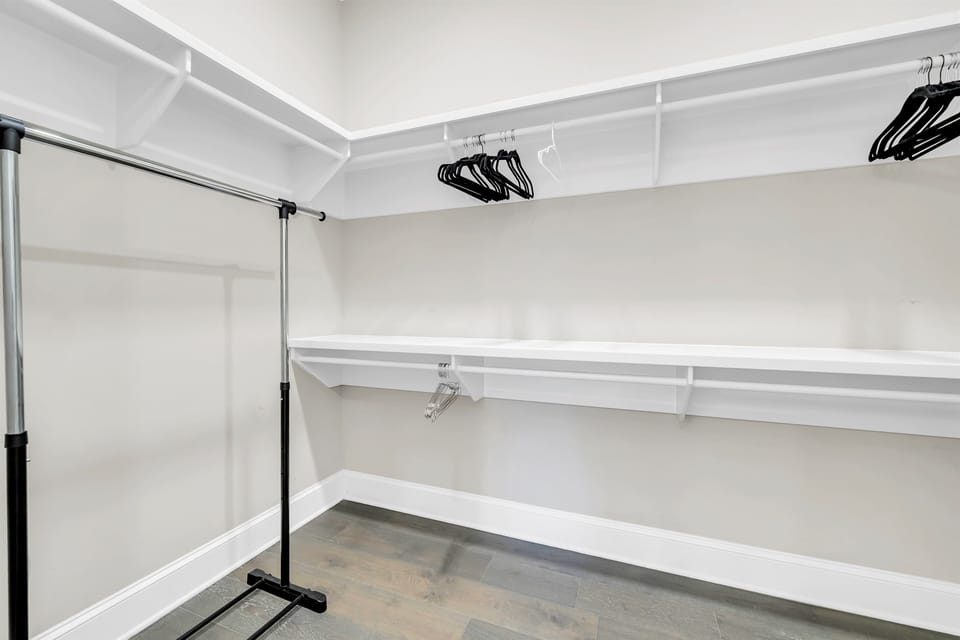 The third floor master bedroom closet has enough space for the largest of wardrobes.