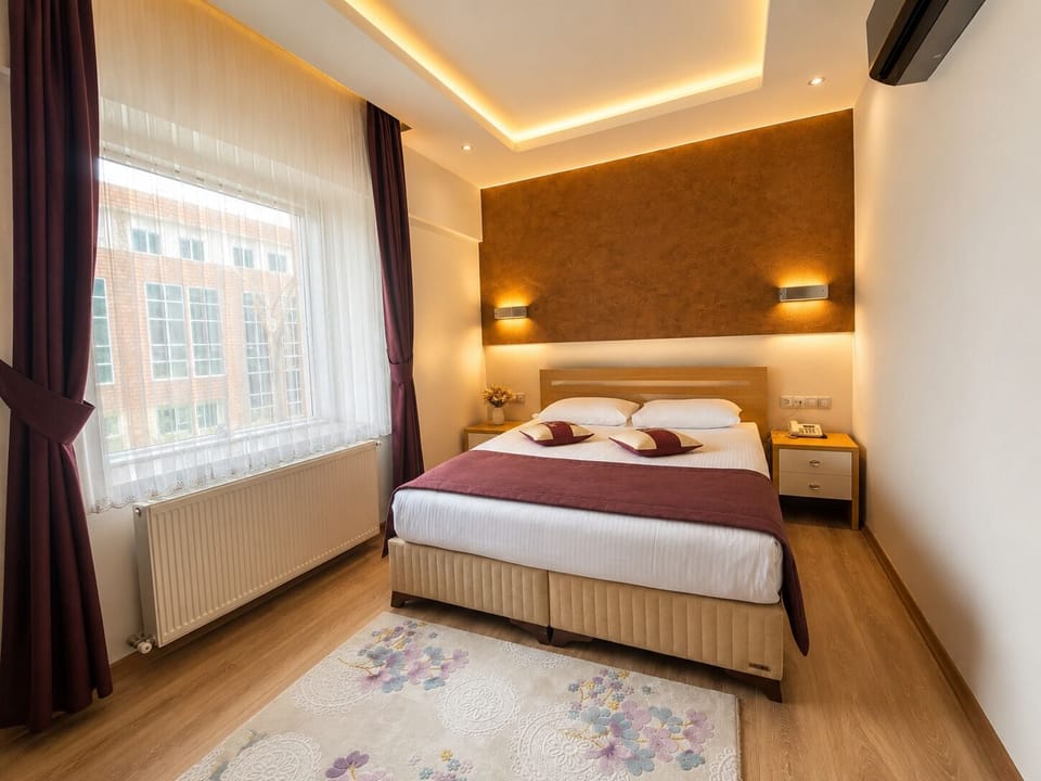 Double Room | Free minibar items, in-room safe, desk, rollaway beds