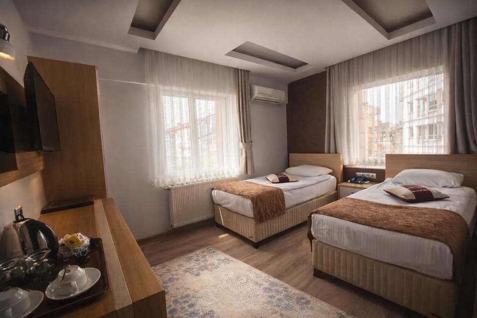 Twin Room | Free minibar items, in-room safe, desk, rollaway beds