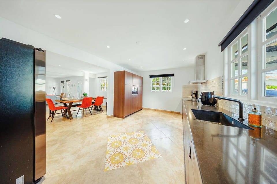 Fully equipped kitchen with ample counter space and essential appliances, ideal for preparing meals during your stay.