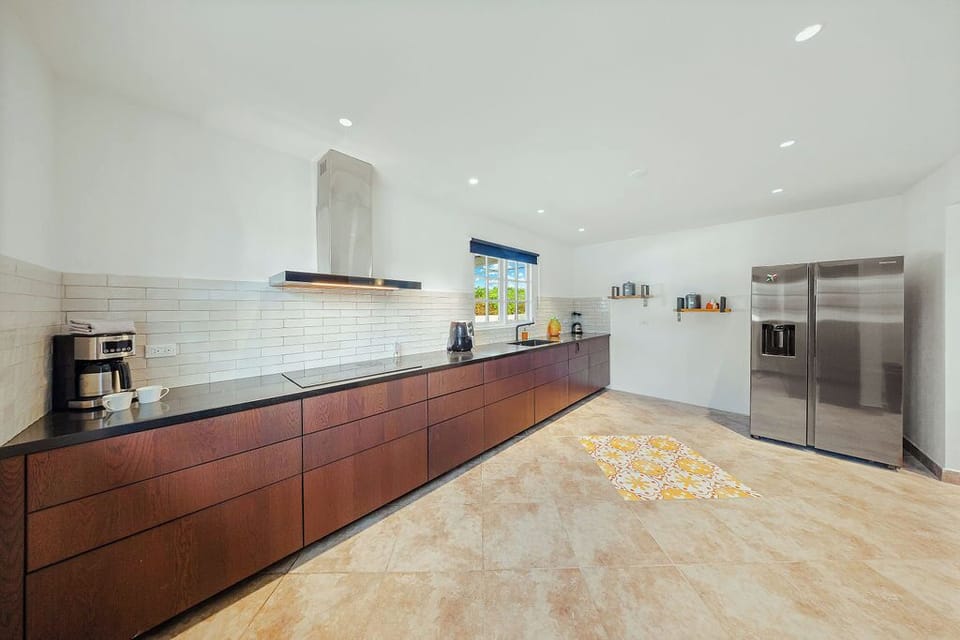 Fully equipped kitchen with ample counter space and essential appliances, ideal for preparing meals during your stay.