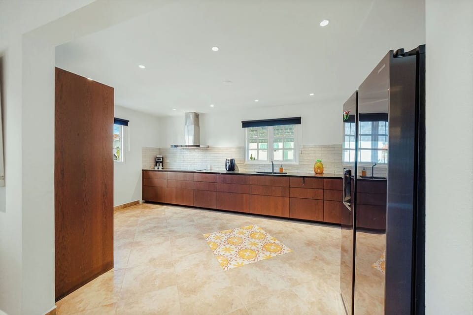 Fully equipped kitchen with ample counter space and essential appliances, ideal for preparing meals during your stay.