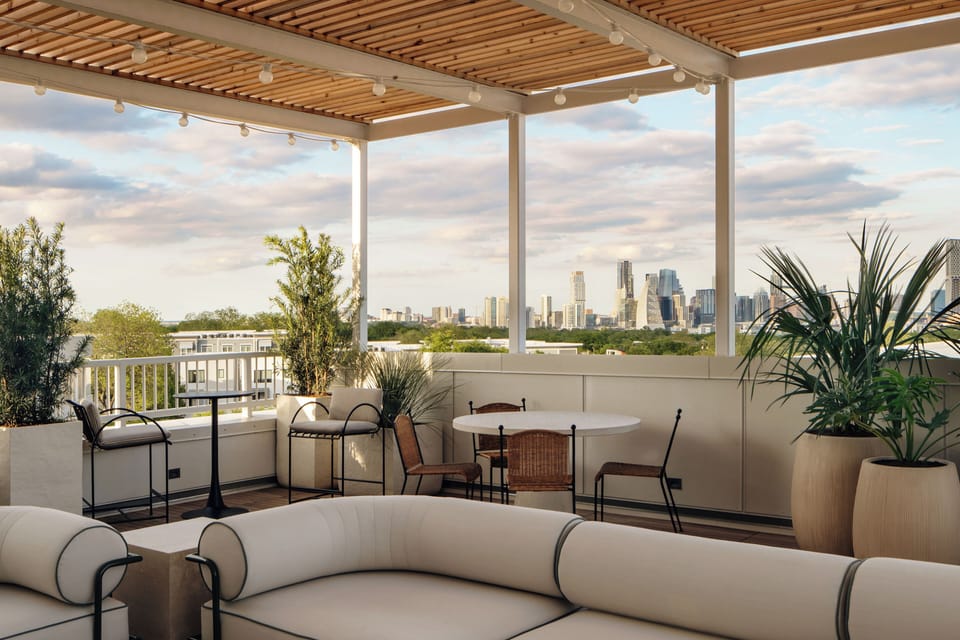 Shared rooftop terrace with skyline views.
