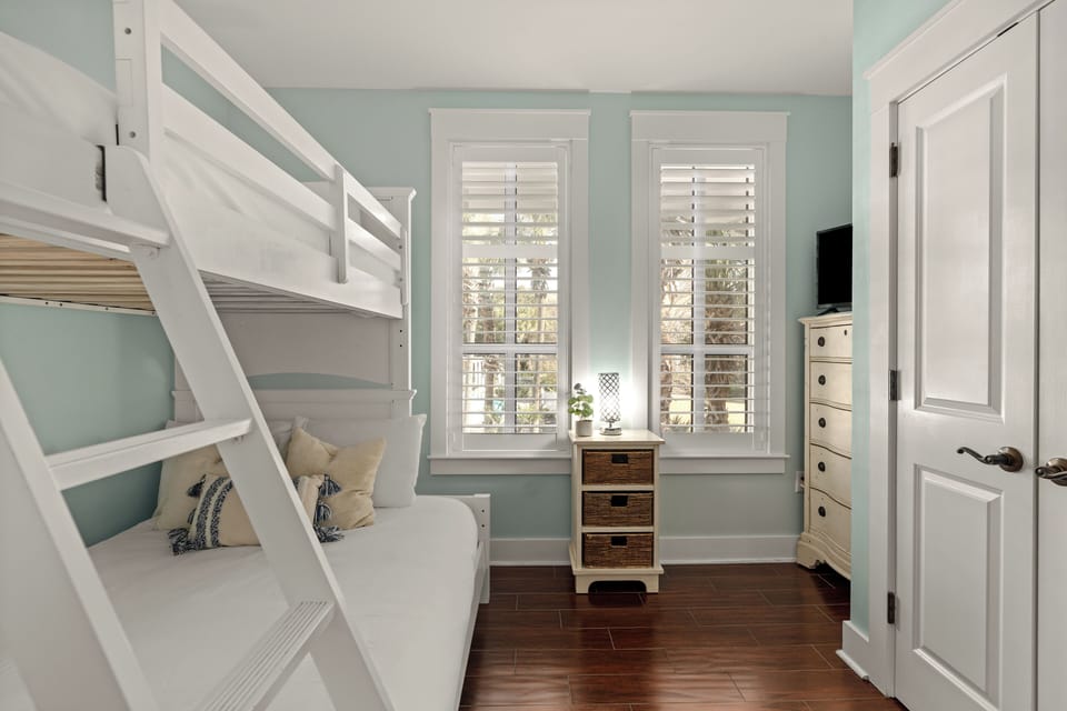 Bedroom 2 features a twin-over-full bunk bed and a TV.