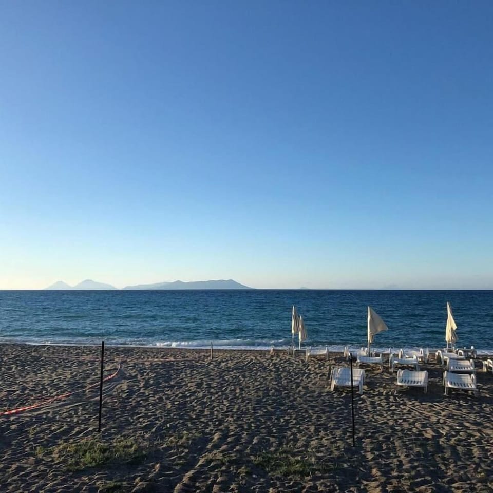 Private beach, white sand, beach umbrellas, beach volleyball