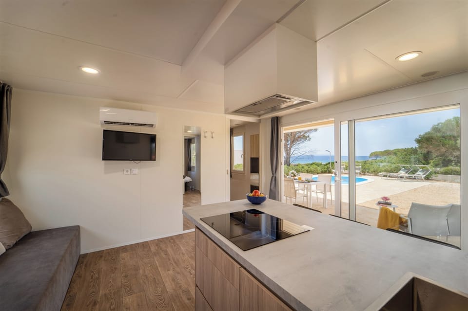 Tamaris Holiday Home with pool | Living area | 32-inch LCD TV with satellite channels