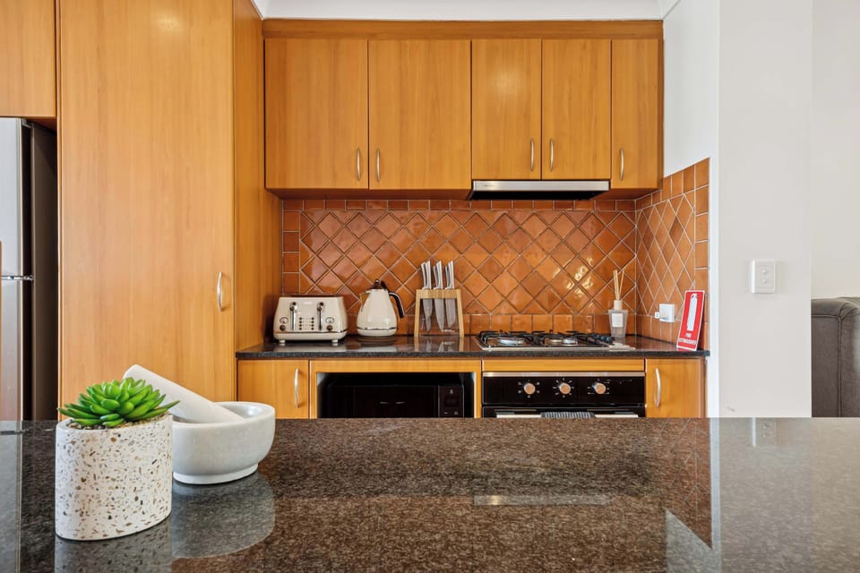 A stylish kitchen designed for convenience, whether it’s a quick breakfast or a full meal.