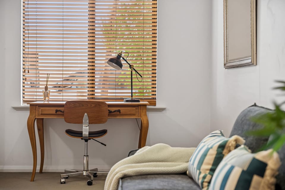 A quiet and functional workspace, perfect for catching up on work or planning your trip.