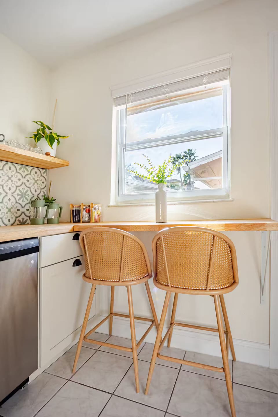 Start your day with a cozy coffee and peaceful views of the patio, backyard, and a little glimpse of the beach beyond.