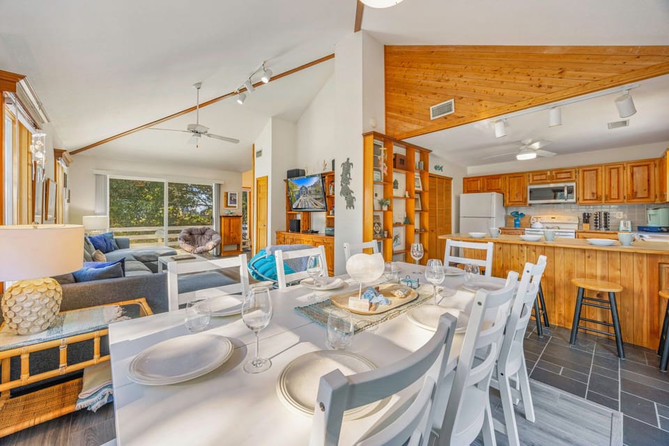 Gather around your elegant dining table for memorable meals, then relax in the spacious living area with mountain views.