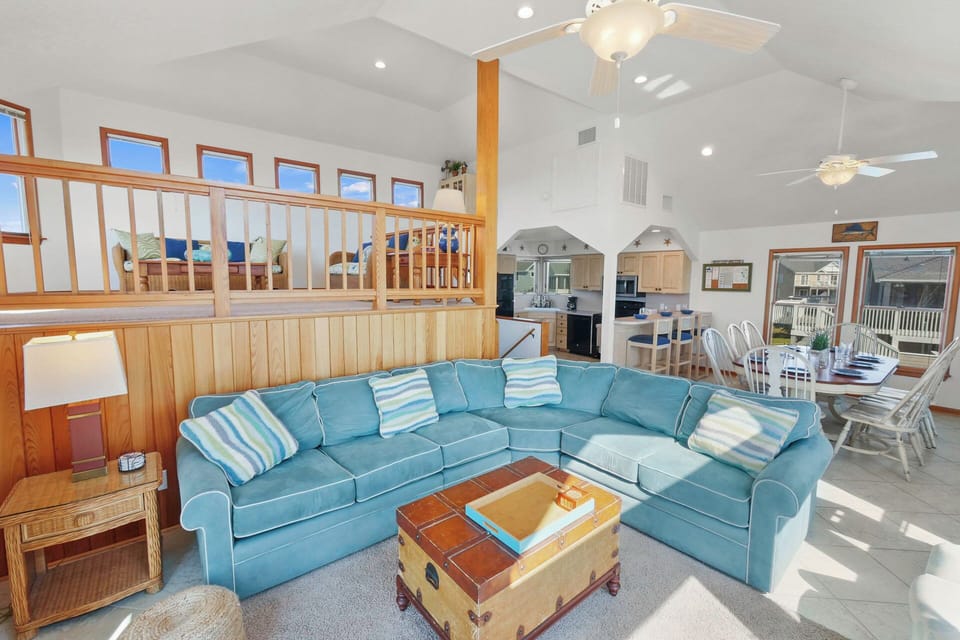 Sink into this spacious sectional sofa where you'll unwind after beach days, with coastal charm throughout your bright, airy retreat.