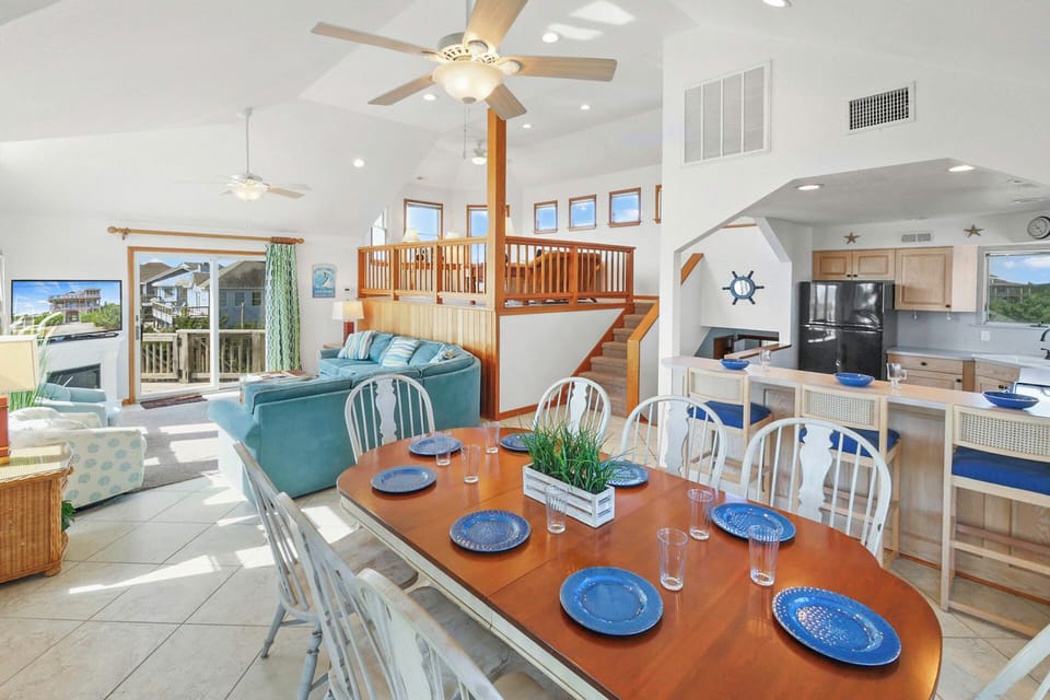 Gather around your spacious dining table while ocean breezes flow through this bright, open living space with loft and full kitchen.