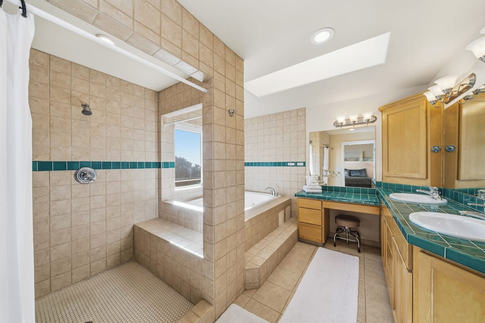 Jacuzzi tub in the master bath with the walk in shower.