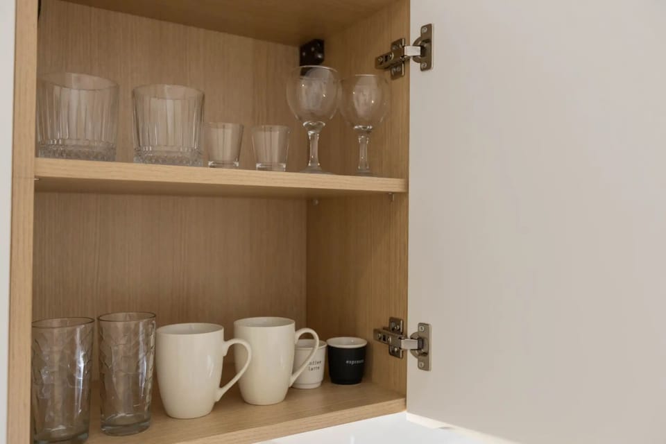 Mini-fridge, stovetop, cookware/dishes/utensils