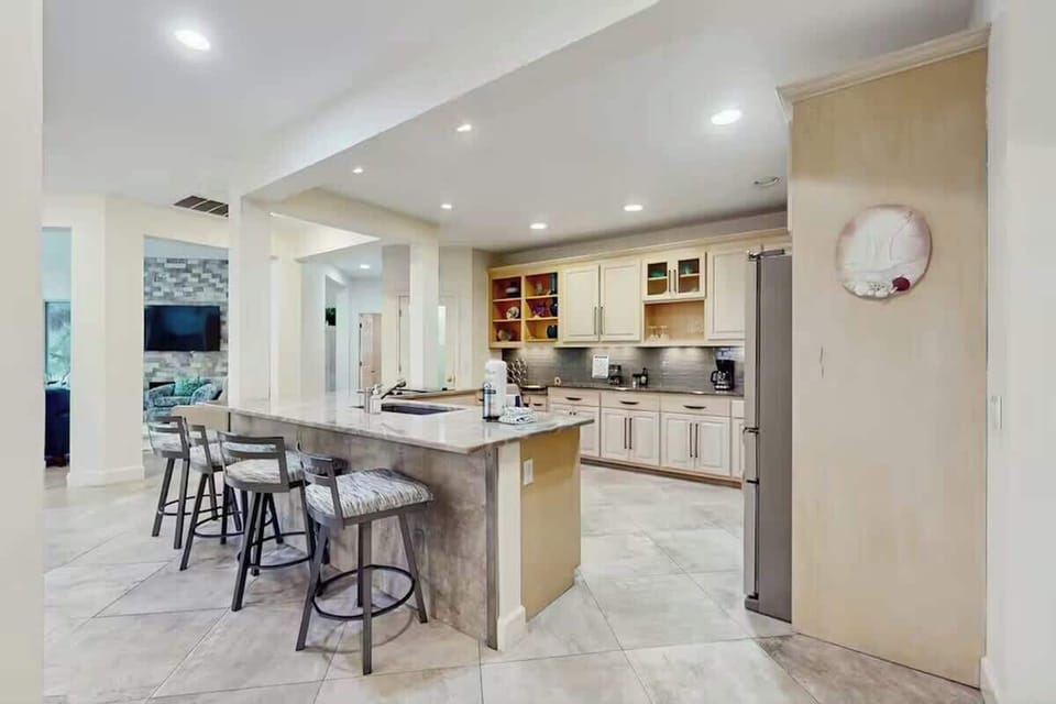 Gather around this spacious kitchen island where you'll love preparing meals and sharing stories over morning coffee.