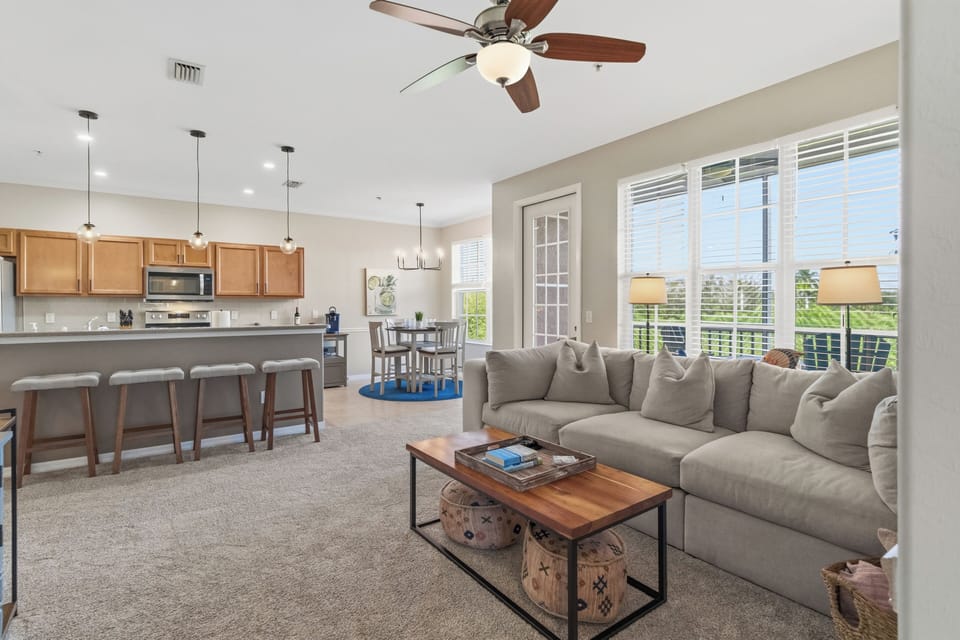 Relax on the comfortable couch that is open to the kitchen and dining area.