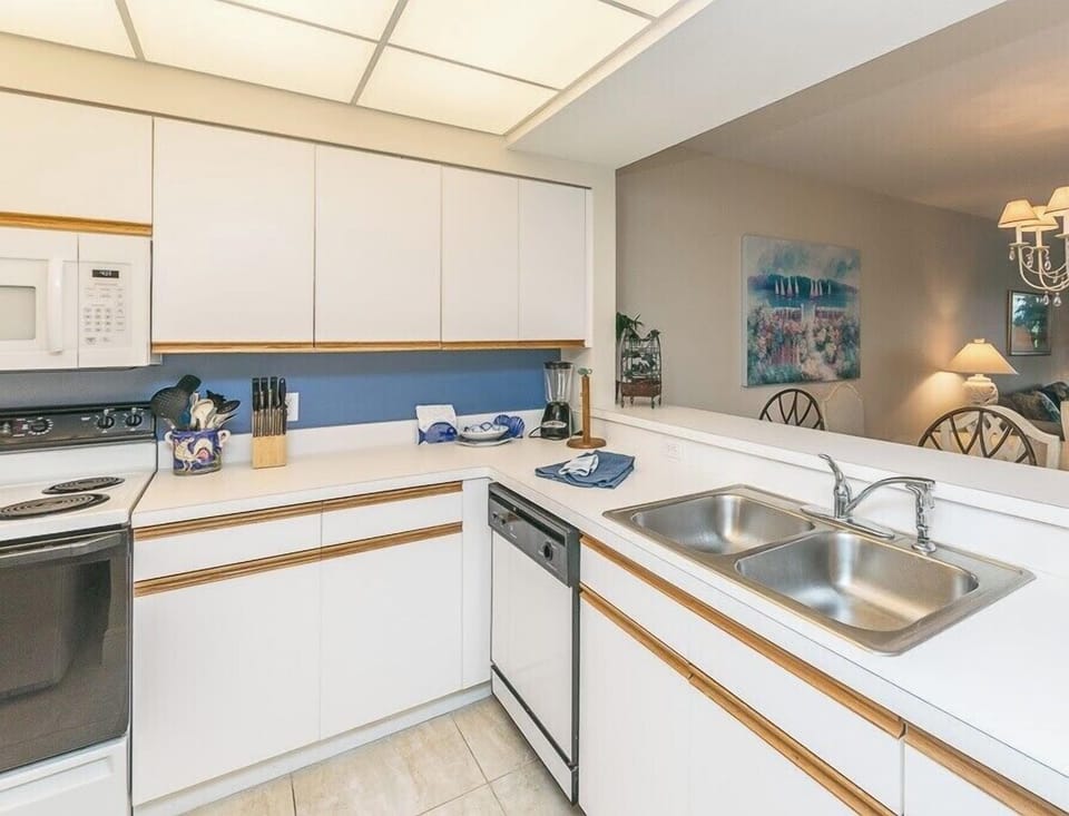 Your fully equipped kitchen awaits with modern appliances, ample counter space, and everything needed to prepare delicious meals during your stay.