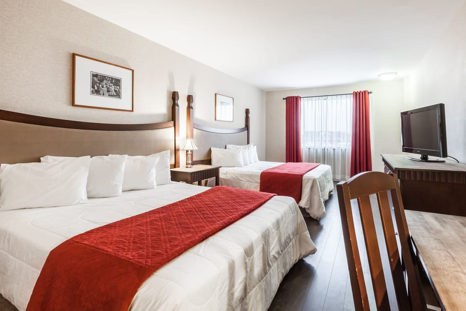 Classic Room, 2 Queen Beds | Desk, blackout drapes, iron/ironing board, cribs/infant beds
