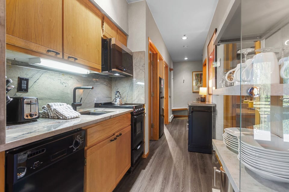 Your fully equipped kitchen makes meal prep a breeze, with sleek countertops, modern appliances, and everything you need to cook like you're at home.
