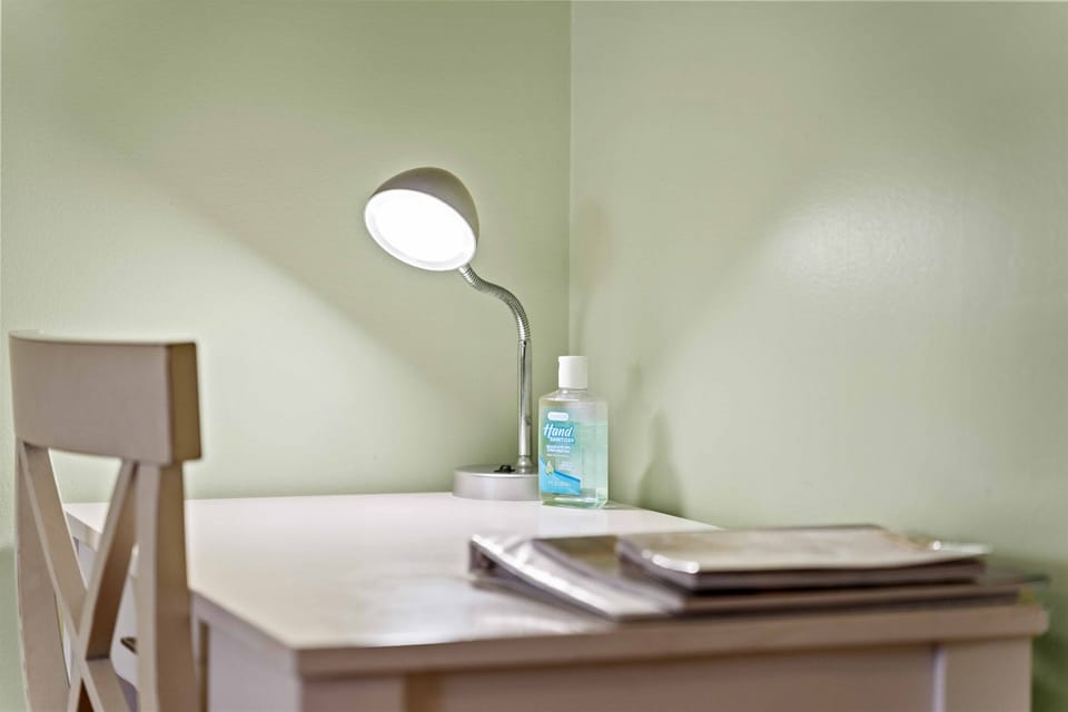 Soft lighting and cozy bedside setup for relaxed evenings.