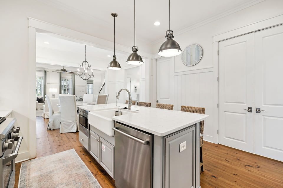 Step into your stunning open-concept kitchen with marble counters, stainless appliances, and pendant lighting—perfect for cooking memorable meals.