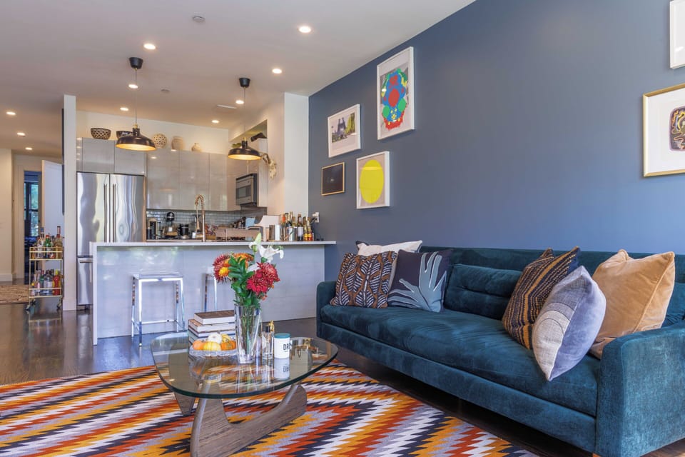 Modern kitchen with island in 2BR Brooklyn duplex.