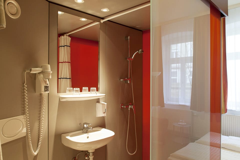 Shower, eco-friendly toiletries, hair dryer, towels
