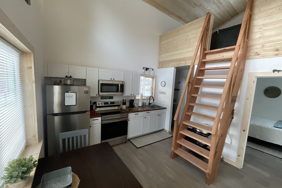 Main floor area.  Bedroom is to the right front.  Bathroom and laundry are to the right rear.  Ships ladder access to the loft living area and additional sleeping space.